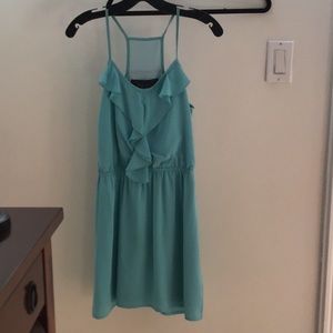 Beautiful short blue dress with ruffle detailing.